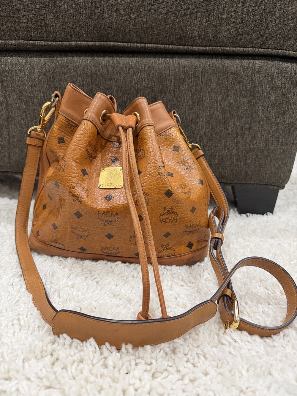 MCM Tan Monogram Drawstring Bucket Bag with Gold Hardware